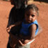 A young mother walks with her child at the Mutitjulu aboriginal community, at the foot of Uluru, also known as Ayres Rock, in the Northern Territory,
