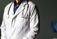 Close up of doctor in coat with stethoscope.