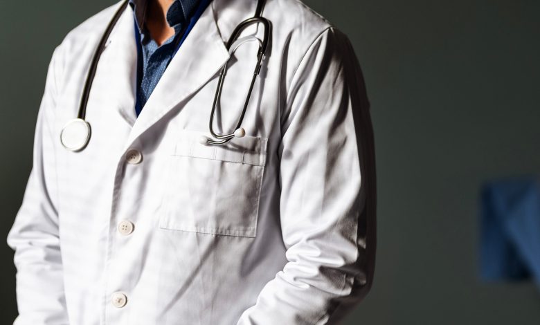 Close up of doctor in coat with stethoscope.