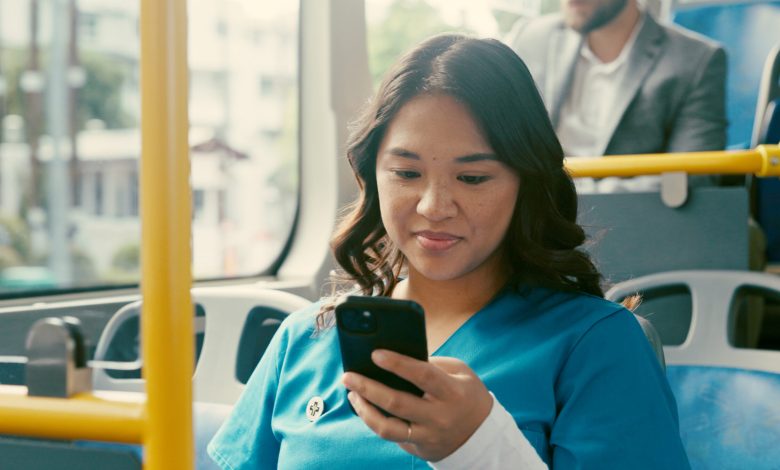 Bus, nurse and woman with smartphone, travel and communication with public transport. Person, healthcare professional and employee with cellphone, morning commute and texting with social media or app