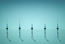 Group of syringes photographed on blue background
