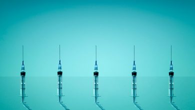 Group of syringes photographed on blue background