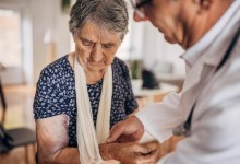 A doctor in a nursing home with a patient