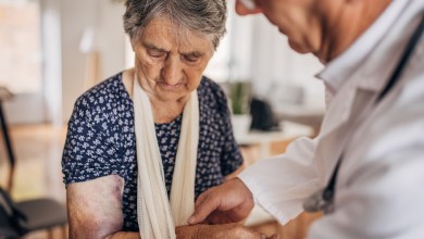 A doctor in a nursing home with a patient