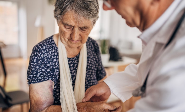 A doctor in a nursing home with a patient