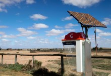 "South Australia, Australia - 12th, May 2012 : Australian Telstra public phone in the outback town of Olary with a solar panel, some areas of Australia mobile phones have no signal."