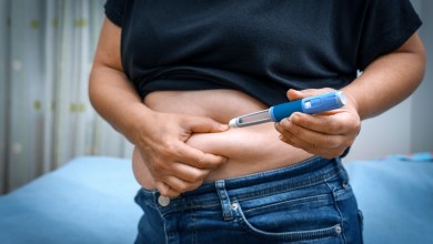 Person injecting insulin into their stomach for diabetes management